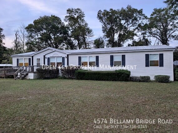 Spacious 4 bedroom, 2 bath mobile home for rent in Marianna, FL - includes lawncare, pets welcome, large back deck and open floor plan - perfect for entertaining. Don't miss out on this rental! property image