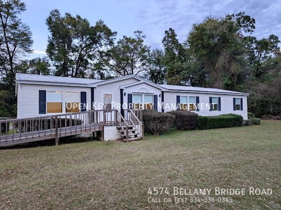 Spacious 4 bedroom, 2 bath mobile home for rent in Marianna, FL - includes lawncare, pets welcome, large back deck and open floor plan - perfect for entertaining. Don't miss out on this rental! property image