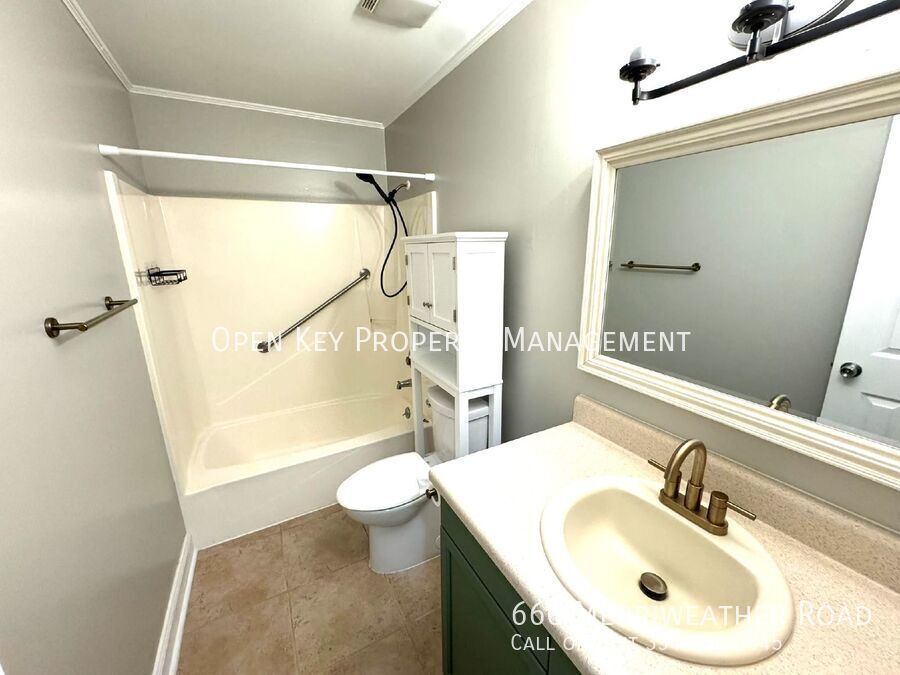 3 bedroom, 2 bath rental in Enterprise, close to Ft. Rucker - stainless steel appliances, shiplap fireplace, enclosed back porch, fenced in backyard. This charming home is move in ready! property image